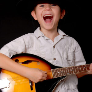 Boy playing mandolin